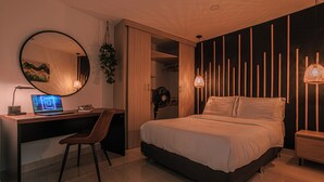 A modern bedroom with a bed, a desk, and a computer. - Private Jacuzzi, Rooftop & BBQ Loft in Medellín (Medellín)