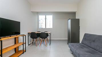 Basic Apartment | Living area | 40-inch TV with digital channels