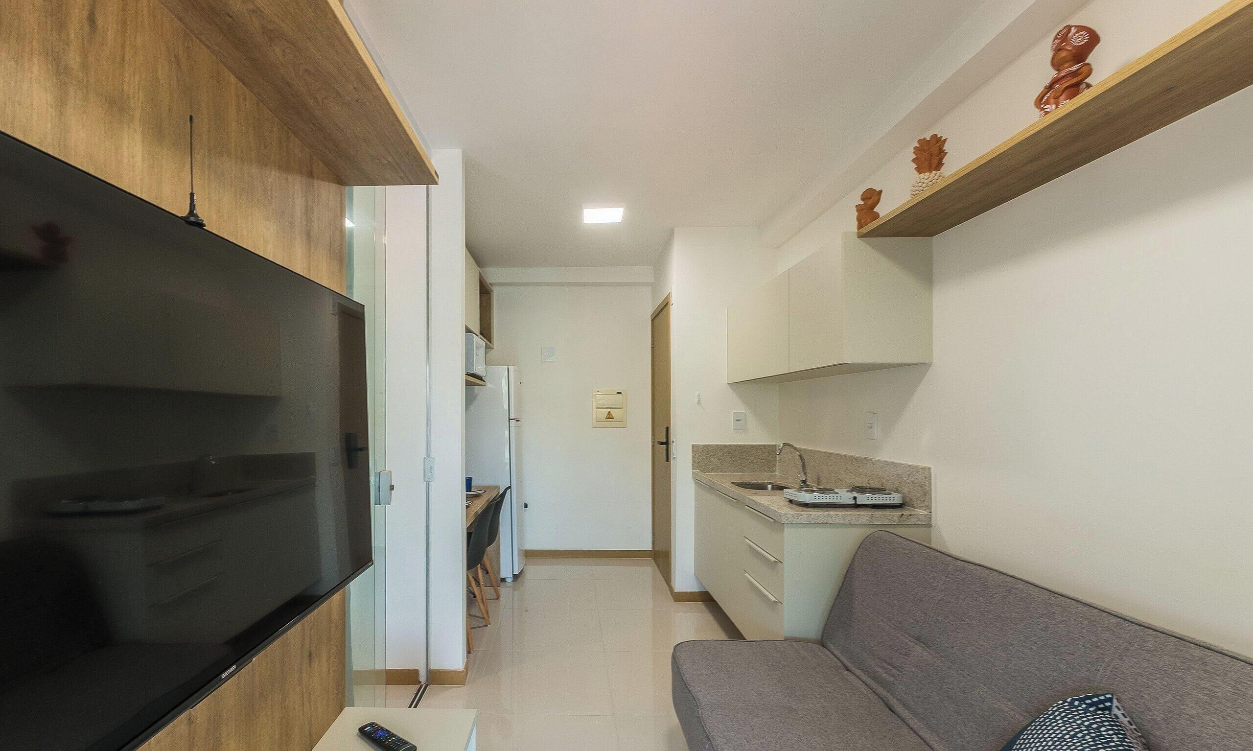 Apartamento básico | Área de estar | TV 40 polegadas com canais digitais