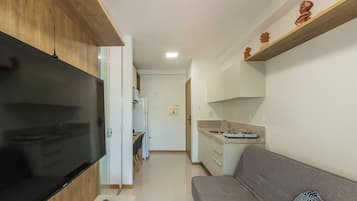 Apartamento básico | Área de estar | TV 40 polegadas com canais digitais