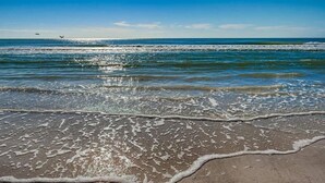 A beach with waves and a clear sky. - SR-12A Gulf Front 1/1 (Siesta Key)