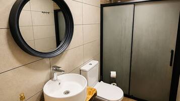 Luxury Bungalow, River View | Bathroom | Combined shower/tub, hair dryer, towels, soap