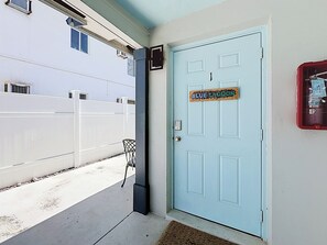 A light blue door with a sign reading 'BLUE LAGOON'. - BLUE LAGOON (Lauderdale-by-the-Sea)