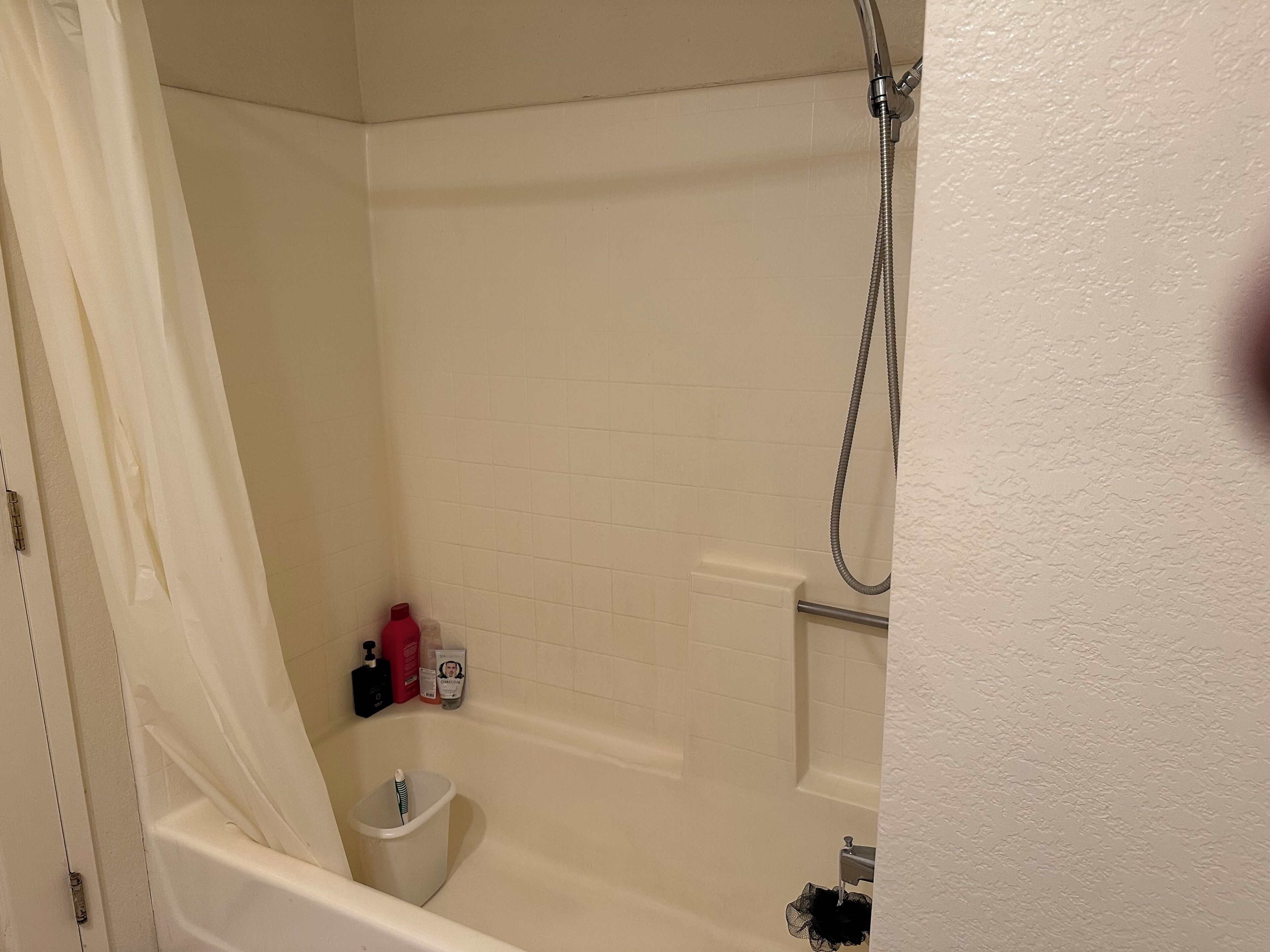 A bathroom with a bathtub, a shower, and a toilet.