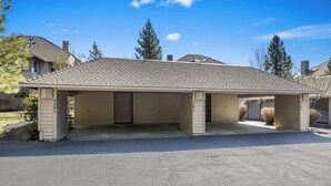 A single-story building with a covered garage and a driveway.