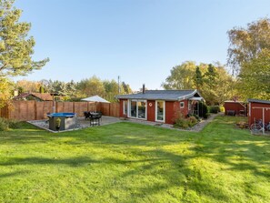 A residential backyard with a swimming pool, patio furniture, and a small shed. - "Aasta" - 500m from the sea by Interhome (Præstø)