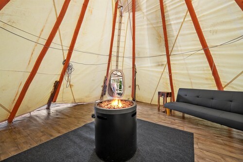 Off grid hike-in Tranquil tipi lodge on mountainside with views