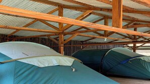 A covered outdoor area with multiple tents set up. - Cozzy Taman Nyingkur (bandung)