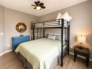 A bedroom with a bunk bed, a dresser, a lamp, and a ceiling fan. - Eagles Nest @ Lands End - Boat Slip! (Osage Beach)
