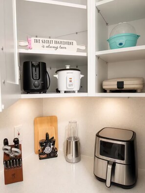 A kitchen with a coffee maker, a slow cooker, a food processor, a juicer, and an air fryer. - Modern Retreat / Private Entrance + Free Parking (West Park)