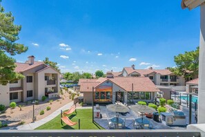 A residential area with multiple houses, a swimming pool, and outdoor seating. - Desert Oasis Near TPC Poo Balcony Parking WD (Scottsdale)