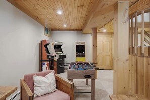 A room with a foosball table, a foosball table, and a foosball table. - Round Hill Retreat | Epic Stratton Views w Hot Tub (Winhall)