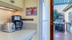 A kitchen with a coffee maker, toaster, and a sign that reads 'Hot Coffee.' - Vin Rouge 51 by Avantstay Sleeps 8 + Hillside Deck + Ping Pong 15-min Walk to Downtown (Paso Robles)