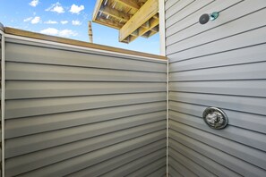 A section of a building with horizontal siding and a metal vent. - The Love Shack, 3-bedroom house in serene Galveston with AC for relaxing stays, (Galveston)