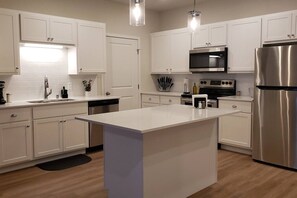 Coffee/tea maker, fridge, microwave, oven