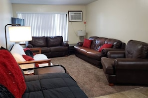 Living area - Husky House! Apt for your group 1.5 mi from Campus (St. Cloud)
