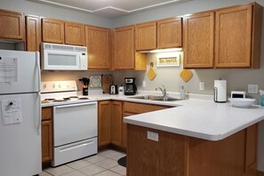 Coffee/tea maker, fridge, oven, stovetop