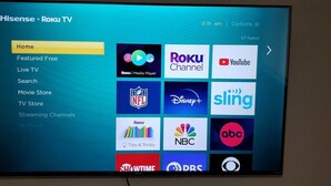A Roku TV interface with a menu bar listing options like Home, Featured Free, Live TV, and more.