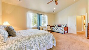 A bedroom with a large bed, a chair, a desk, and a wardrobe. - Peace of Mind by Avantstay Fenced BBQ Yard + Game Table Paso Robles (Paso Robles)