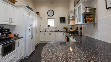 Coffee/tea maker, fridge, microwave, oven