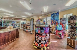 A brightly lit store with shelves of colorful merchandise, including plush toys and accessories. - WP2355 - Spacious townhome near all parks (Kissimmee)