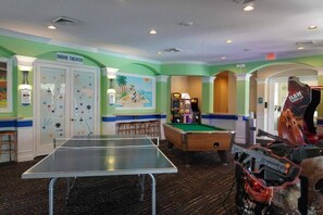 A room with a ping pong table, pool table, and arcade games. - WP2355 - Spacious townhome near all parks (Kissimmee)