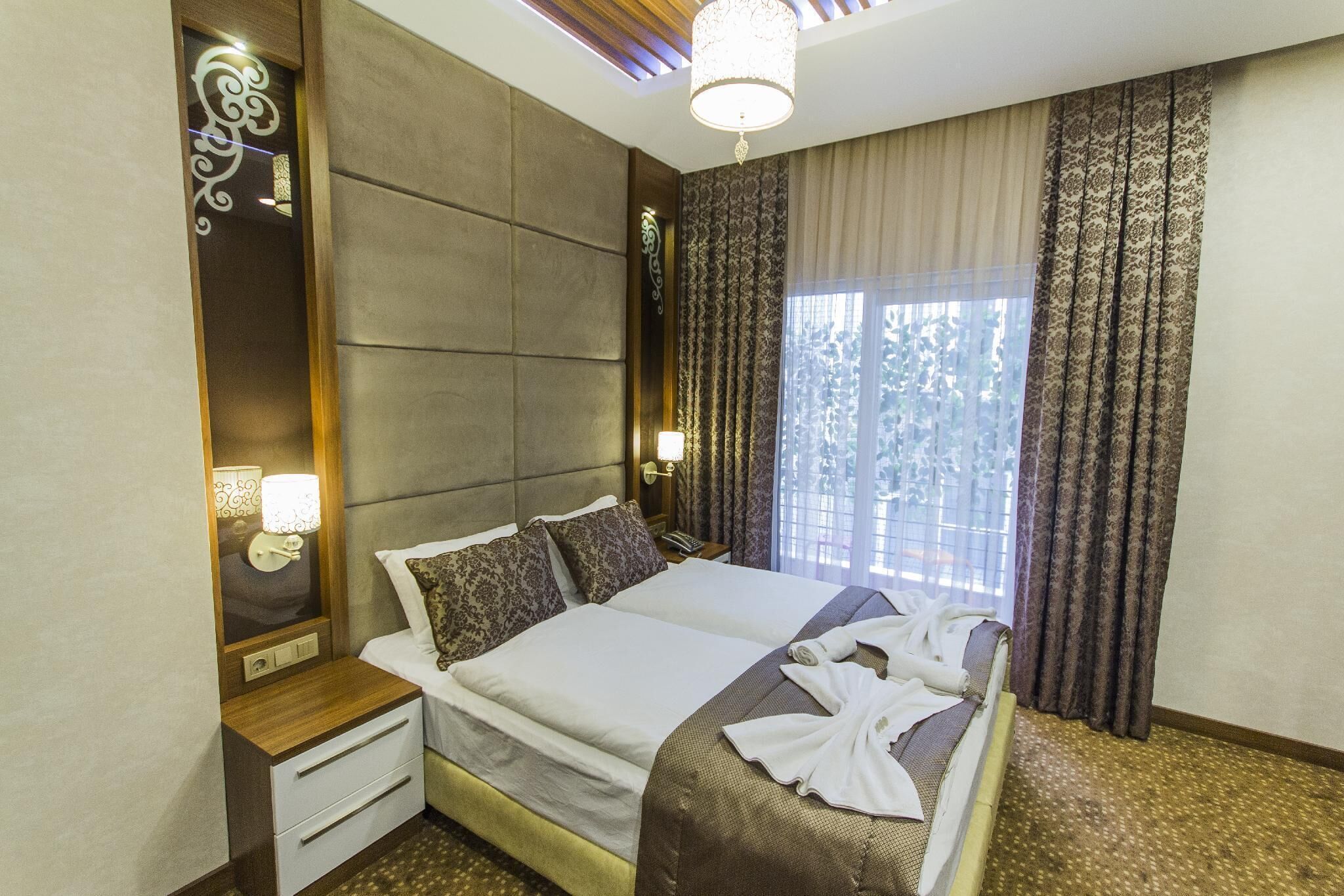 Deluxe Triple Room, Balcony | In-room safe, desk, blackout curtains, soundproofing