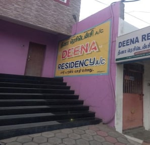 A building with a signboard for 'DEENA RESIDENCY A/C' and a staircase leading to the entrance. - Deena Residency (Attur)