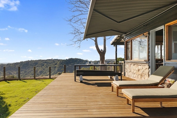 Balcony with outdoor dining, sunlounges and BBQ