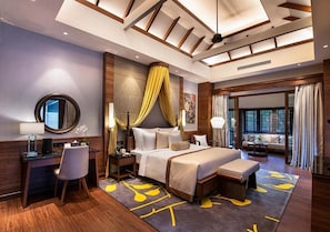 A modern hotel room with a large bed, a desk, and a seating area. - The Villa at Sunway Resort Hotel (Petaling Jaya)