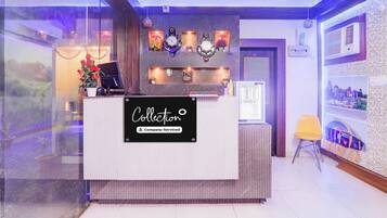 A reception desk with a sign that reads 'Collection Company-Serviced'.