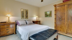 A bedroom with a bed, bedside tables, lamps, a wardrobe, and wall art. - Walk to Main St Stroudsburg! Historic Dtwn Home (Stroudsburg)