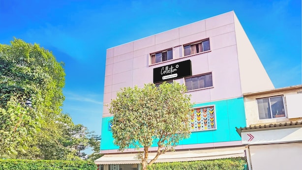 A modern building with a sign indicating it is a company-serviced collection. - Super Collection O Pune Nagar Road Viman (Pune)