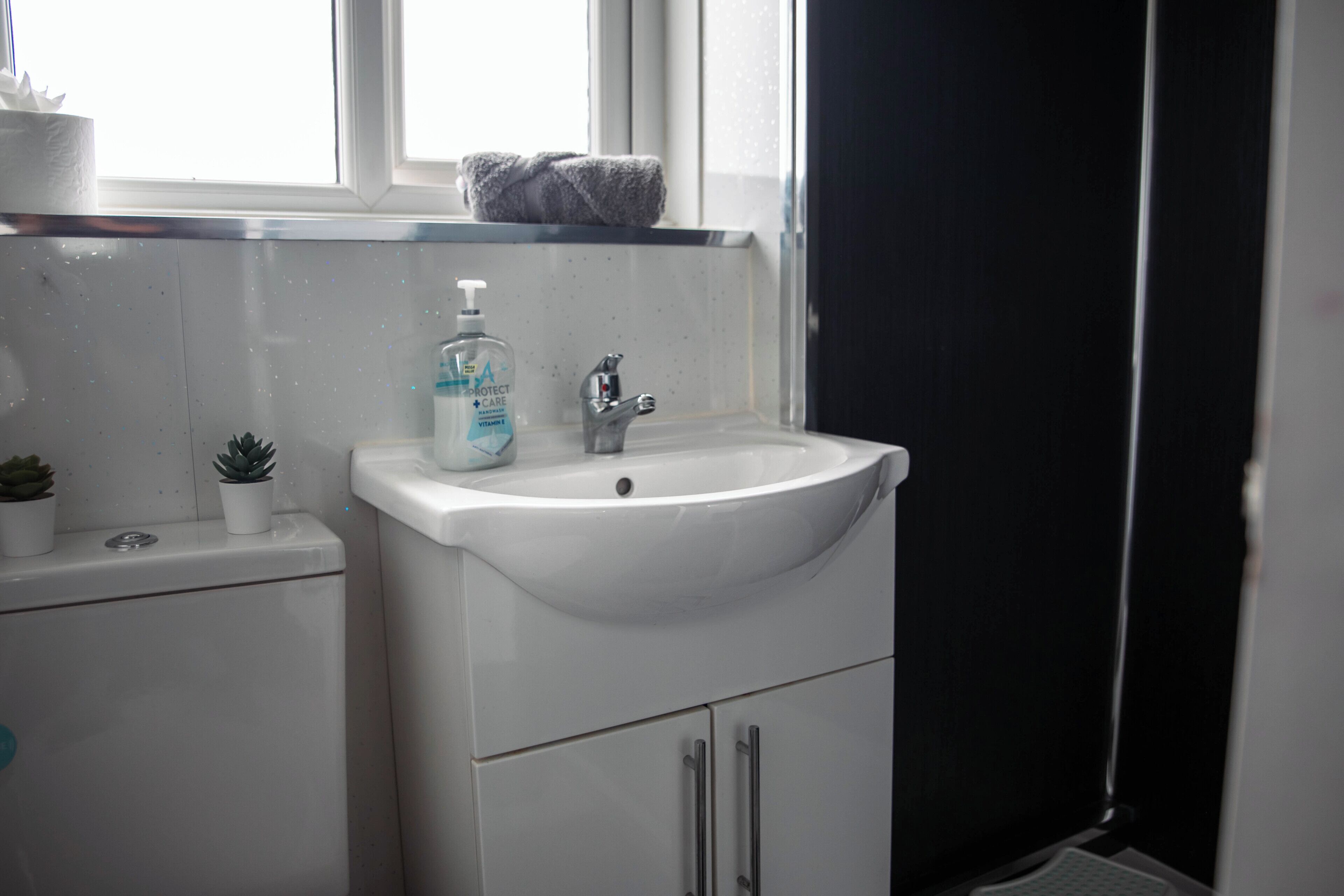 Shower, towels, soap, toilet paper