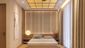 A modern bedroom with a large bed, bedside tables, a wall-mounted light, and a ceiling with recessed lighting. - Midori Hotel Da Lat (Lam Vien - Da Lat)