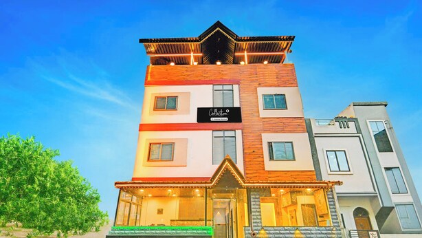 A multi-story building with a sign reading 'Collection' and a staircase leading to the entrance. - Super Collection O Mahakal (Ujjain)