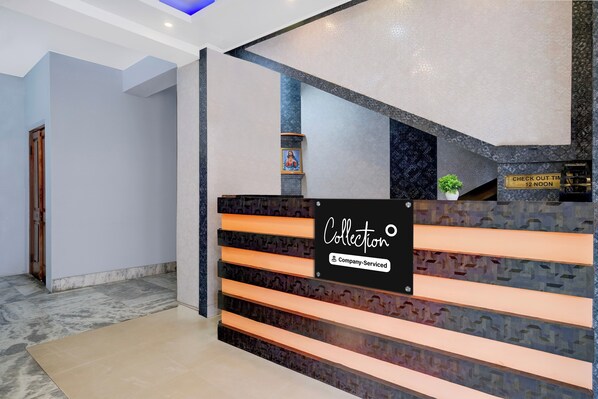 A reception area with a sign indicating 'Collection' and 'Company-Served'.