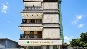 A multi-story building with a sign reading 'THE MAPLE'. - Collection O Sevoke Crossway Siliguri (Siliguri)