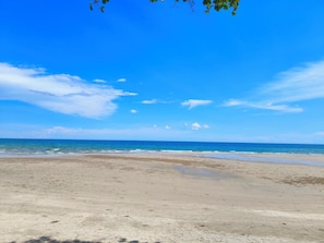 A beach with clear skies and calm waters.