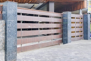 A modern building with a multi-level parking garage.