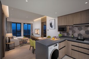 Premier Suite, City View | Living area | 60-inch Smart TV with digital channels