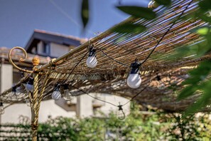 A hammock with multiple light bulbs attached to it.
