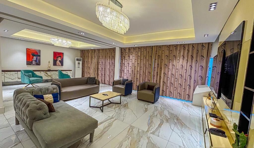 Deluxe Apartment, 3 Bedrooms, Balcony, City View | Living area | 50-inch LED TV with cable channels, Netflix, streaming services