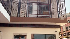 A two-story building with a restaurant on the ground floor and a signboard above the entrance. - Shree Krishna Hotel & Restaurant (Sakrai)