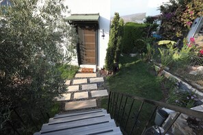 A staircase leading to a door with a small garden area beside it. - LUXURY VILLA W/SWIMMING POOL IN BODRUM TURKEY (Mİlas)