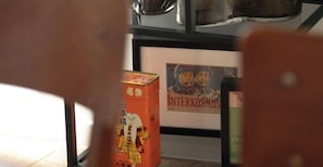 A framed artwork titled 'INTERKOSMOS' and a traditional Japanese box with cultural designs. - Canal Saint-Martin — 2 pièces lumineux (Paris)