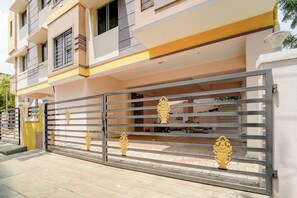 A multi-story residential building with a gated entrance. - Super Collection O Madurai Junction (Madurai)