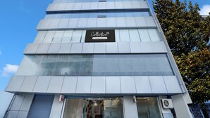 A modern building with a sign indicating it is a company-serviced collection. - Collection O Rajeev Nagar Near Atal Path (Patna)