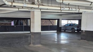 An underground parking garage with concrete floors and multiple levels.