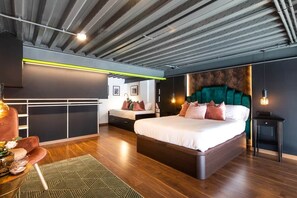 A modern bedroom with a large bed, a sofa, and a desk. - To complete (Valencia)